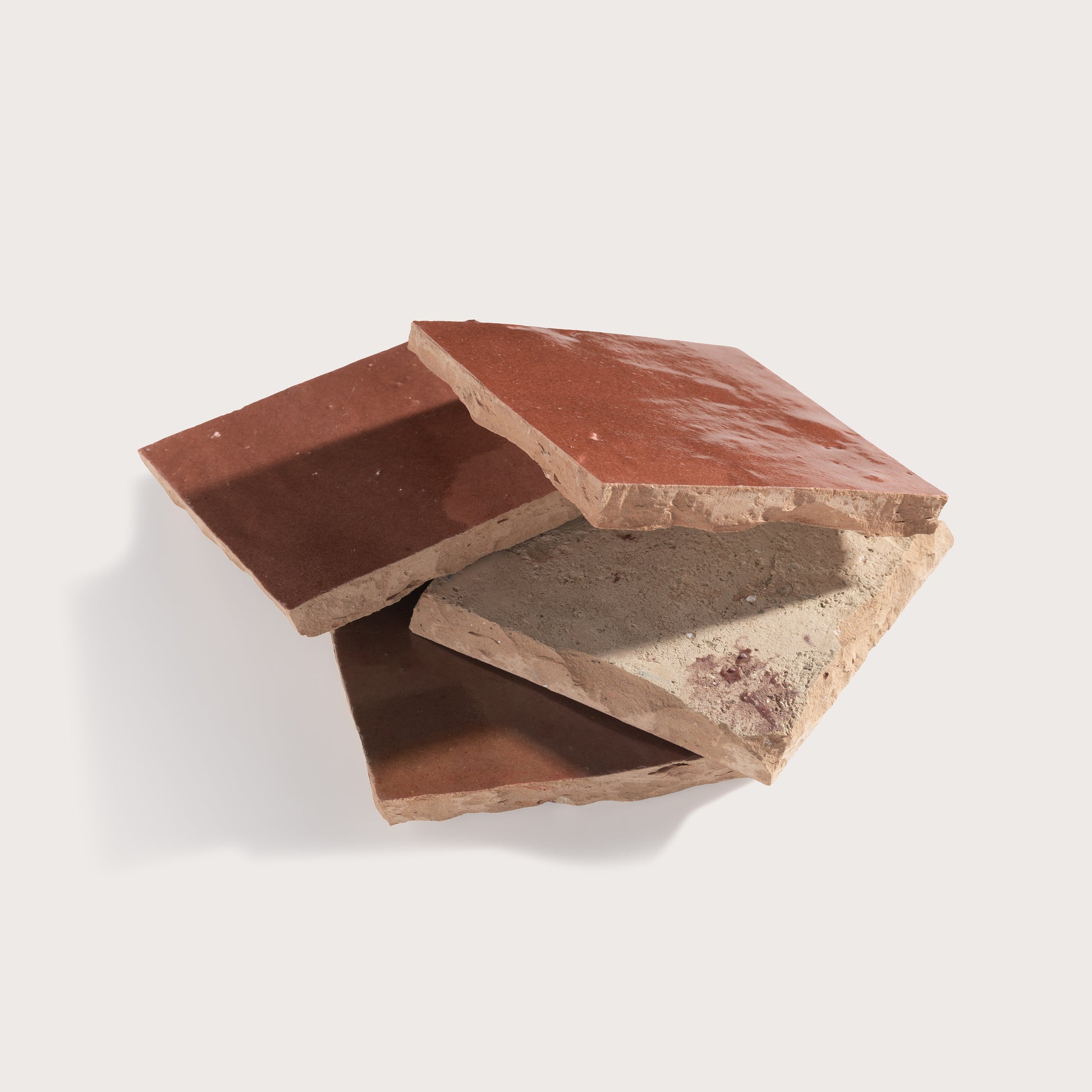 red square zellige tile stacked on a light gray background