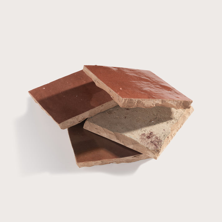 red square zellige tile stacked on a light gray background