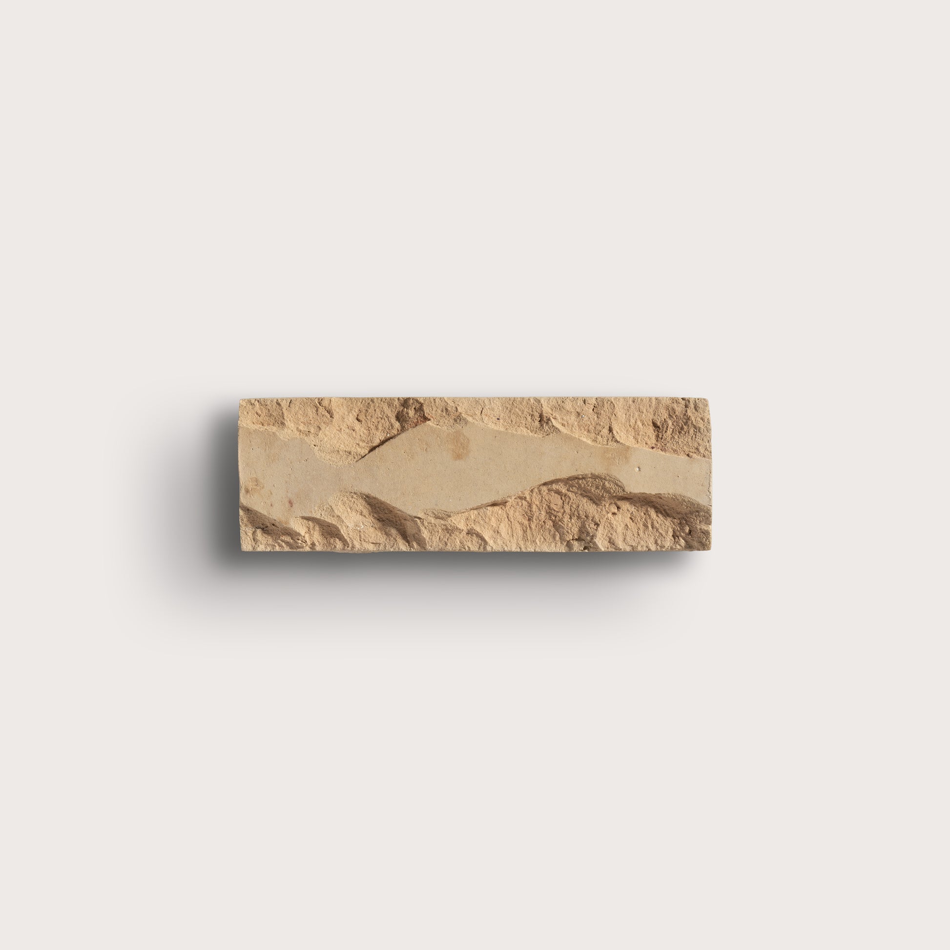 brown rectangle zellige tile on a gray background