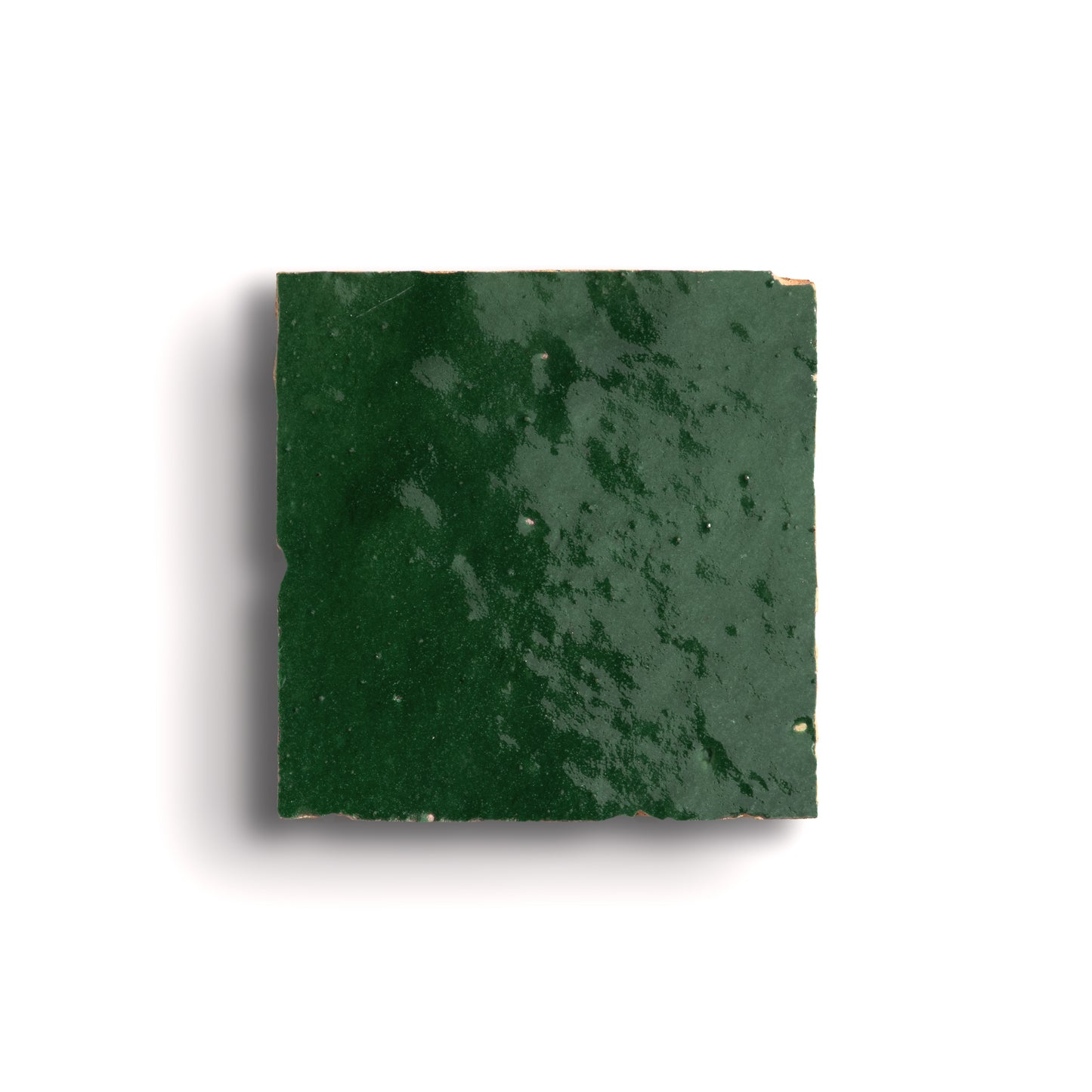 Square piece of green zellige tile on a white background