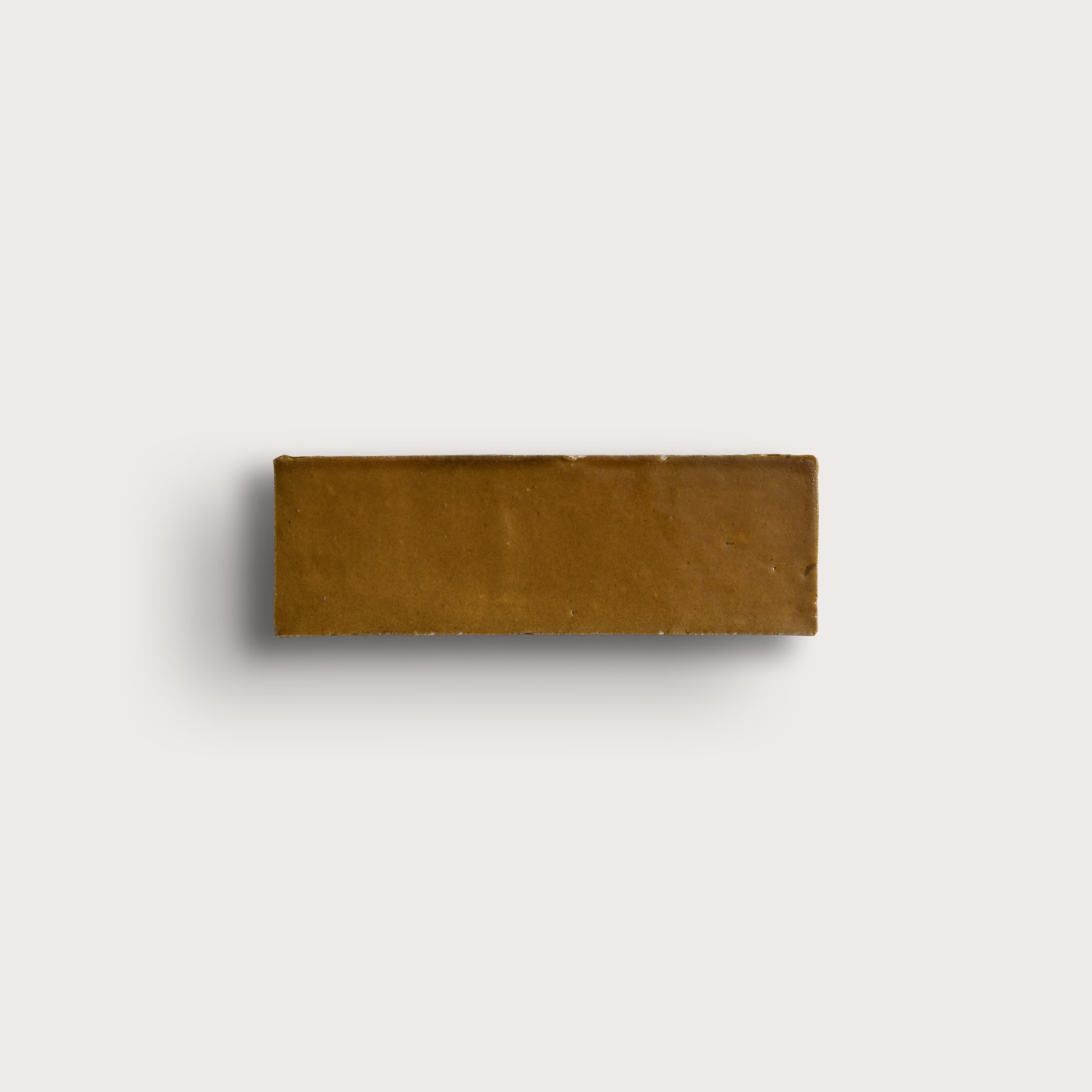brown rectangle zellige tile on light gray background