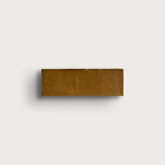 brown rectangle zellige tile on light gray background