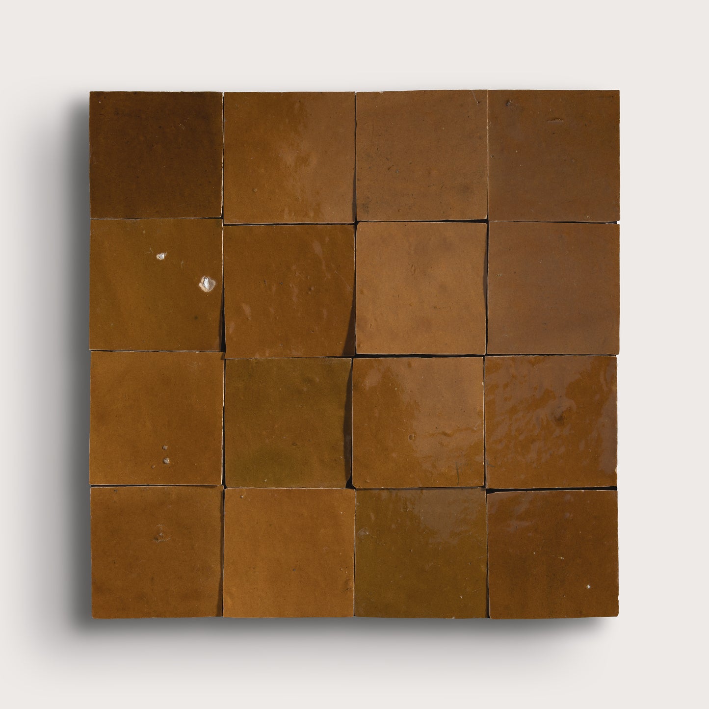 brown square zellige tile on light gray background