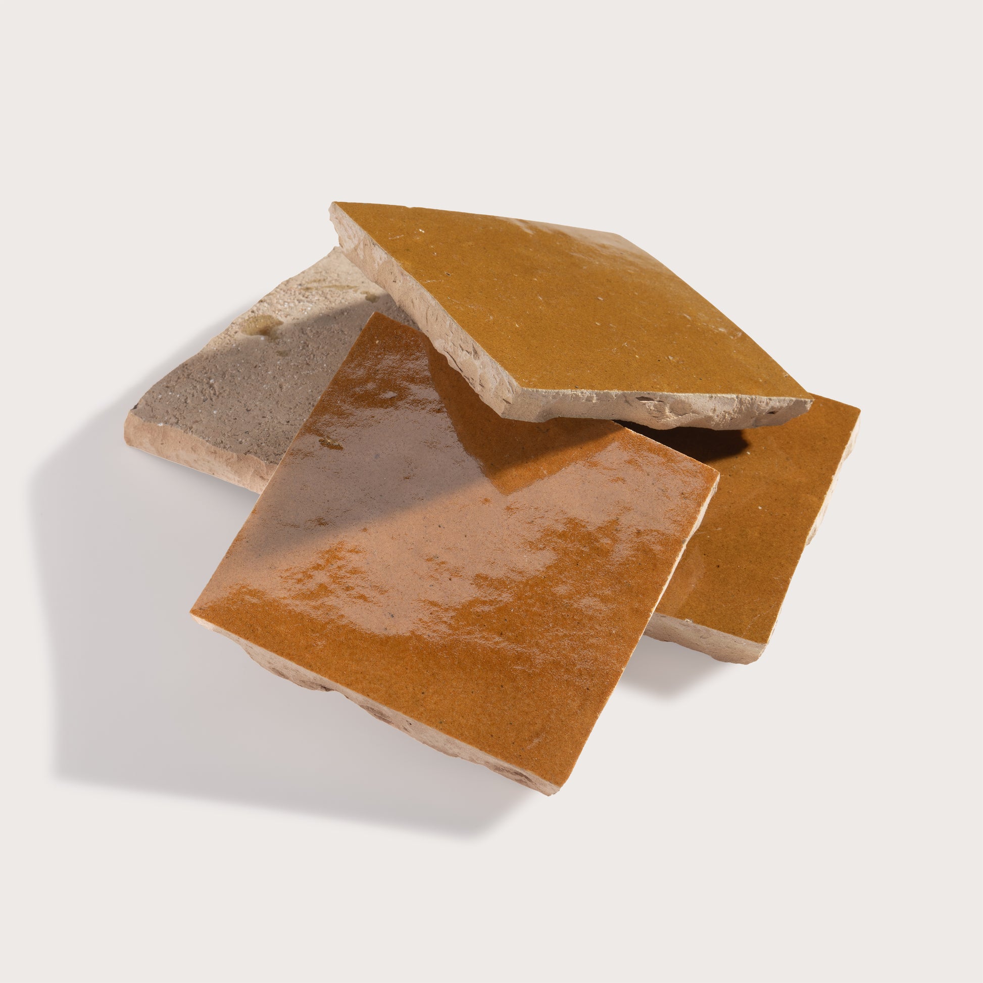 brown square zellige tile on light gray background