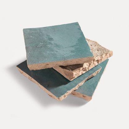 zellige tiles with a greenish-blue surface on a light gray background