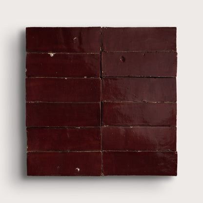 red rectangle zellige tile in a grid on light gray background