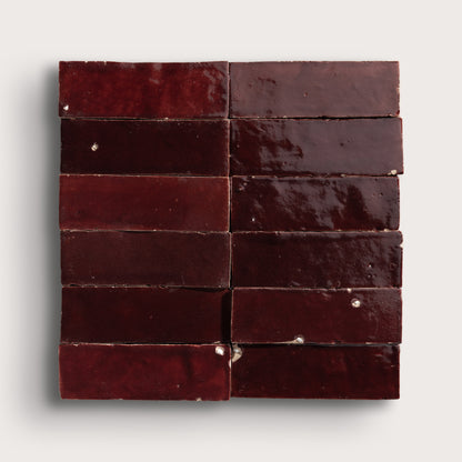 red rectangle zellige tile in a grid on light gray background
