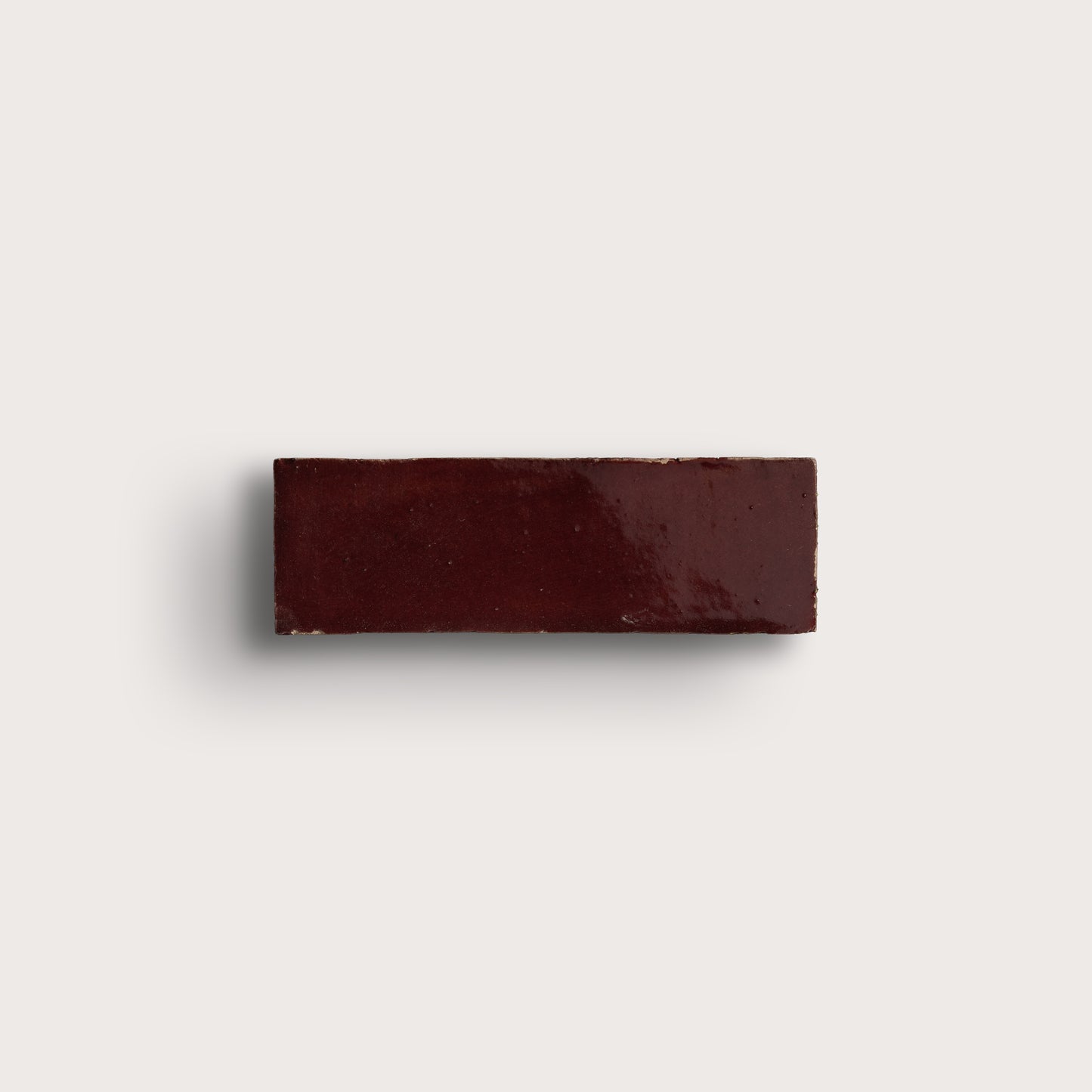 red rectangle zellige tile on light gray background