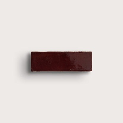 red rectangle zellige tile on light gray background