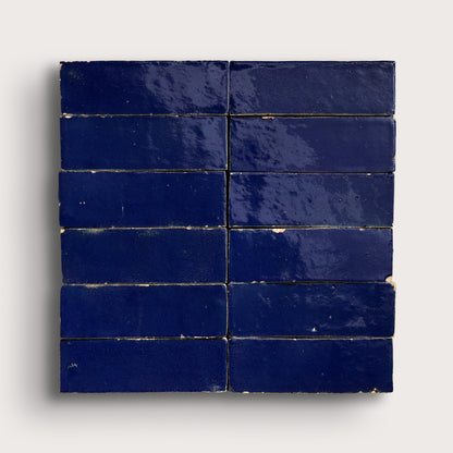 rectangle blue zellige tiles arranged in a grid on light grey background