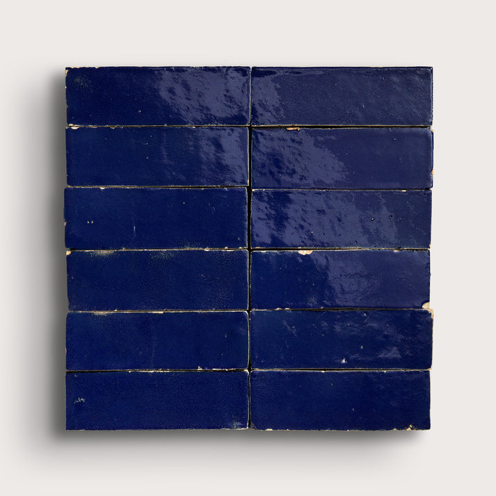 rectangle blue zellige tiles arranged in a grid on light grey background