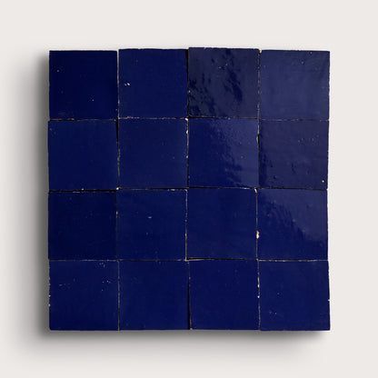blue square zellige tile in grid pattern on light grey background