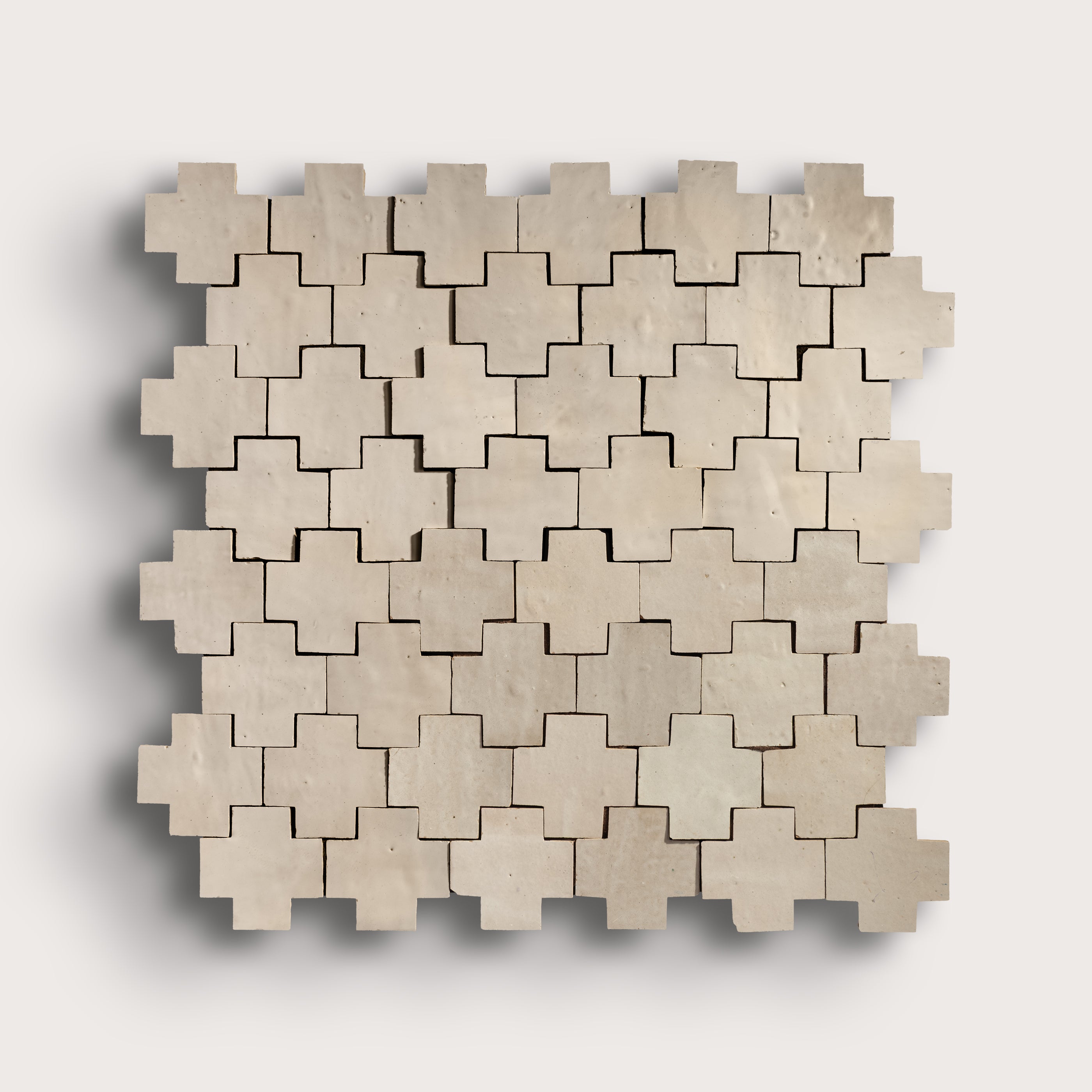 natural white zellige tile in a cross pattern