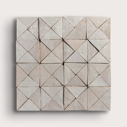natural white mosaic triangle zellige tile on a light grey background