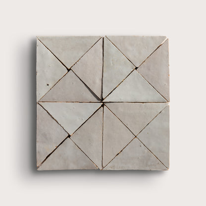 natural white mosaic triangle zellige tile on a light grey background