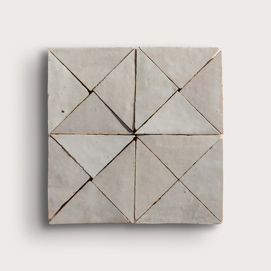 natural white mosaic triangle zellige tile on a light grey background