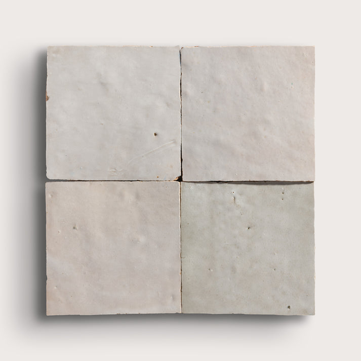 natural white square zellige tile arranged in grid on light grey background