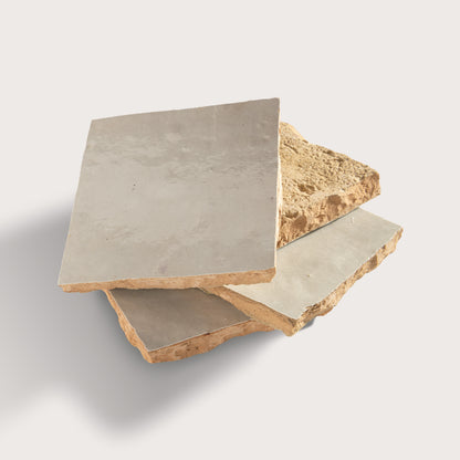 natural white square zellige tile arranged in a stack on light grey background