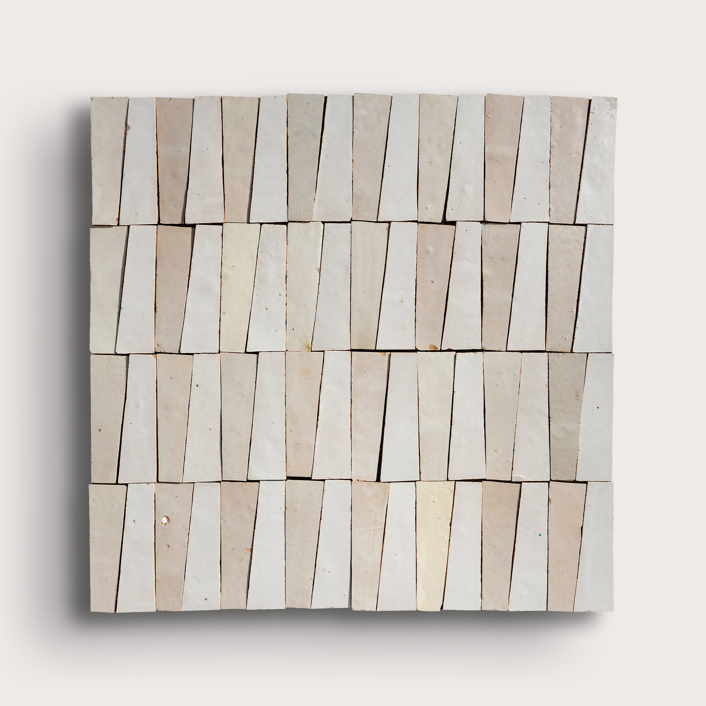 white trapezoid zellige tile on a light gray background