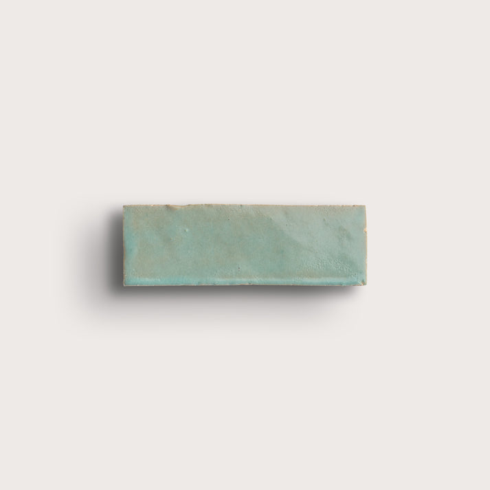 green rectangle zellige tile on light gray background