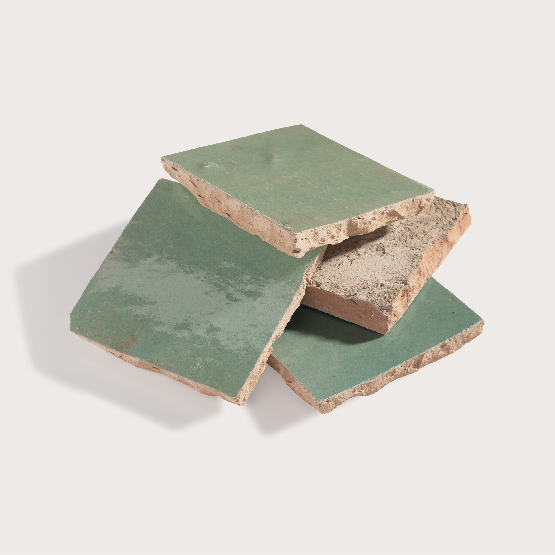stack of green square zellige tiles
