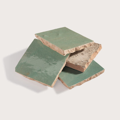 stack of green square zellige tiles