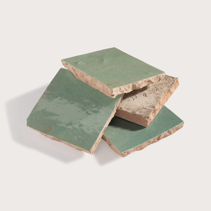 stack of green square zellige tiles