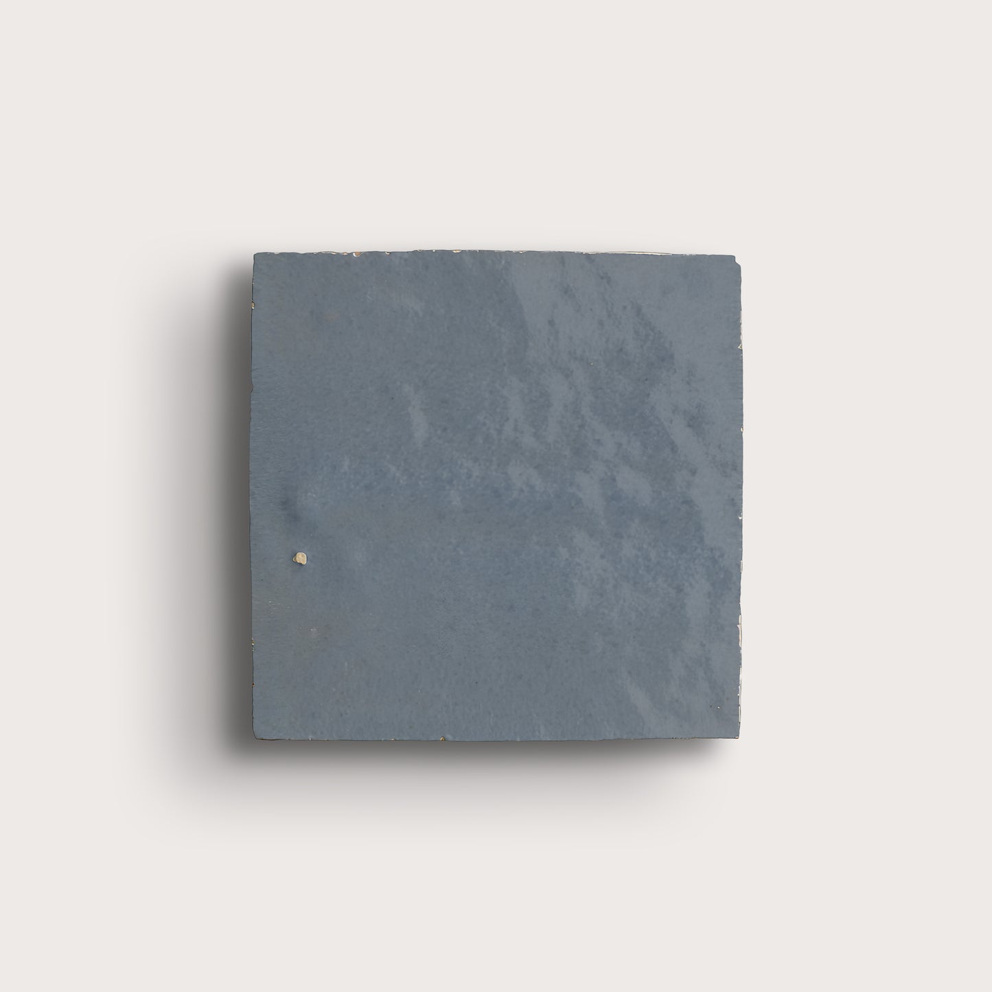 square zellige tile in a grid on a light gray background