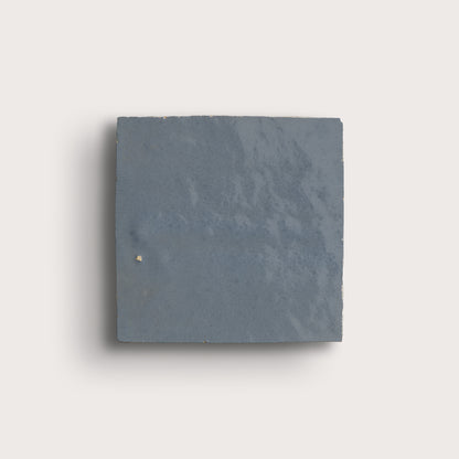 square zellige tile in a grid on a light gray background