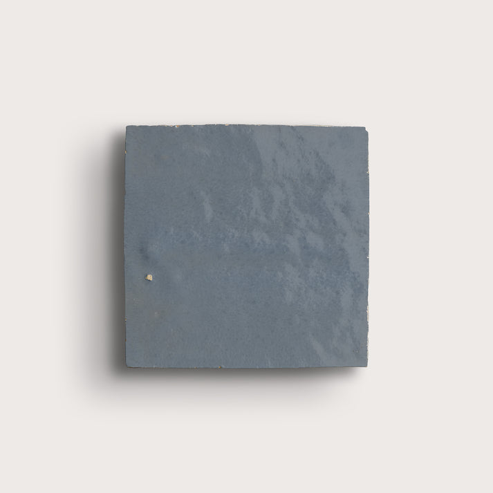 square zellige tile in a grid on a light gray background