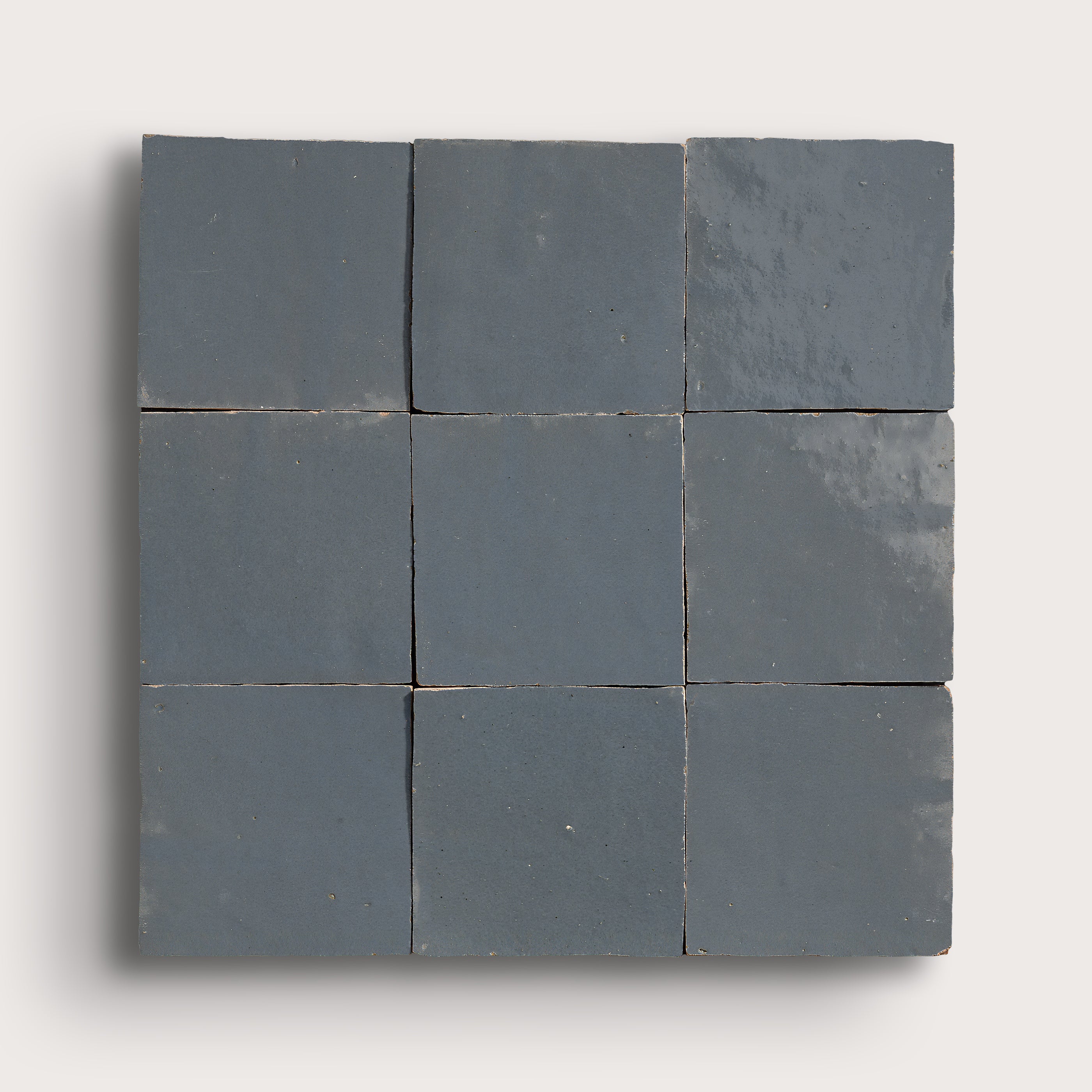square zellige tiles in a grid on a light gray background