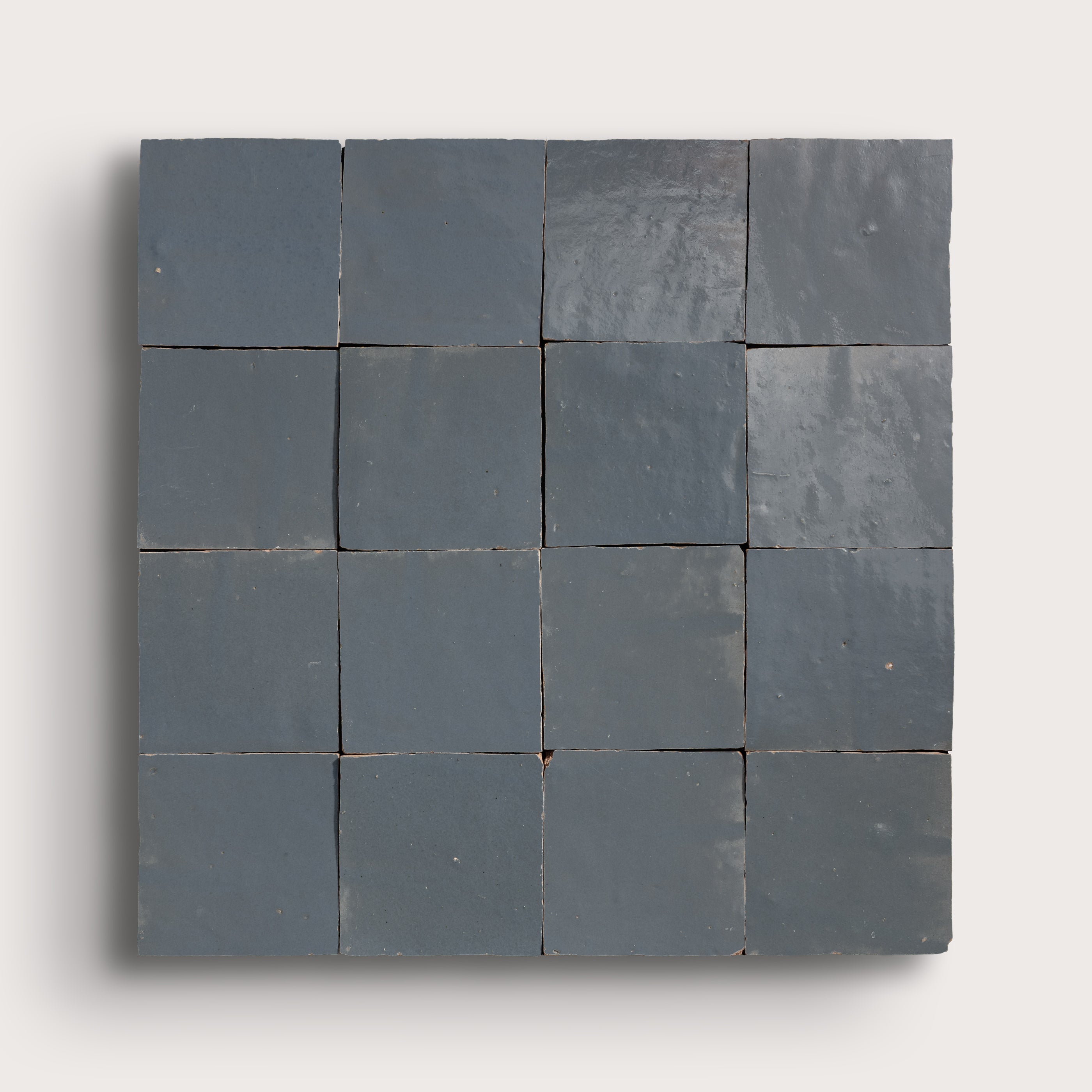 square zellige tiles in a grid on a light gray background