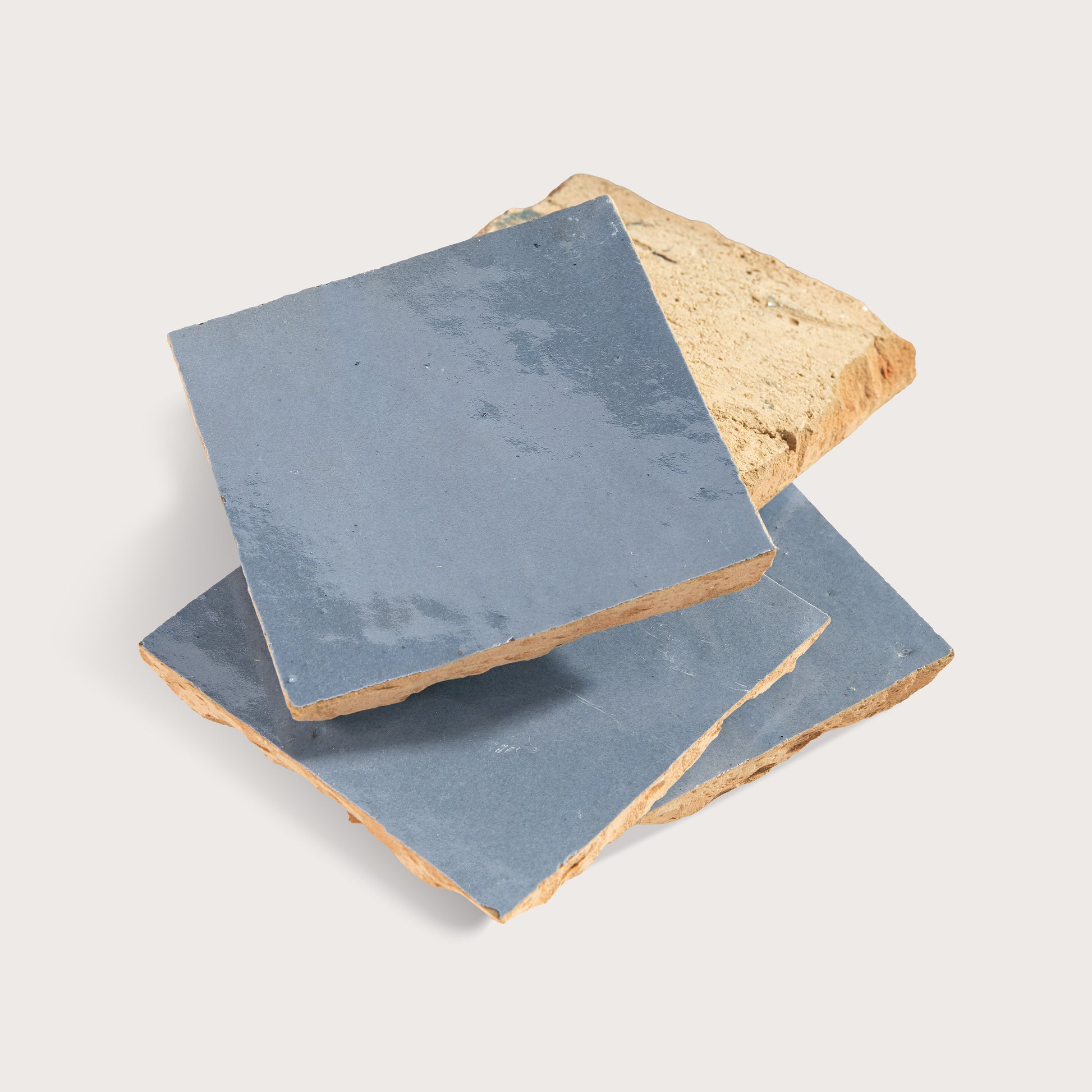 blue square zellige tile on light gray background