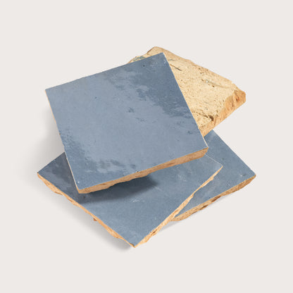 blue square zellige tile on light gray background