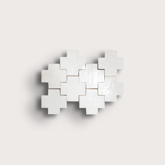 white zellige tile with geometric design on a white background