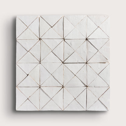 snow white mosaic traingle zellige tile on a light grey background