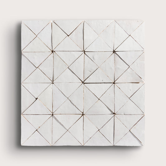 snow white mosaic traingle zellige tile on a light grey background