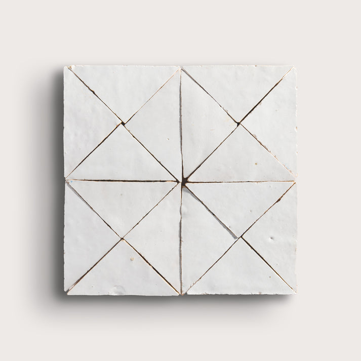 snow white mosaic traingle zellige tile on a light grey background