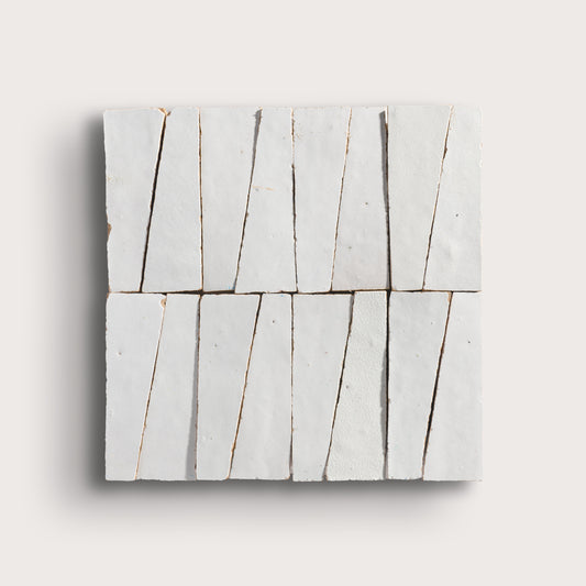 snow white trapezoid zellige tile on a light grey background