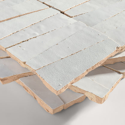 snow white trapezoid zellige tile on a light grey background