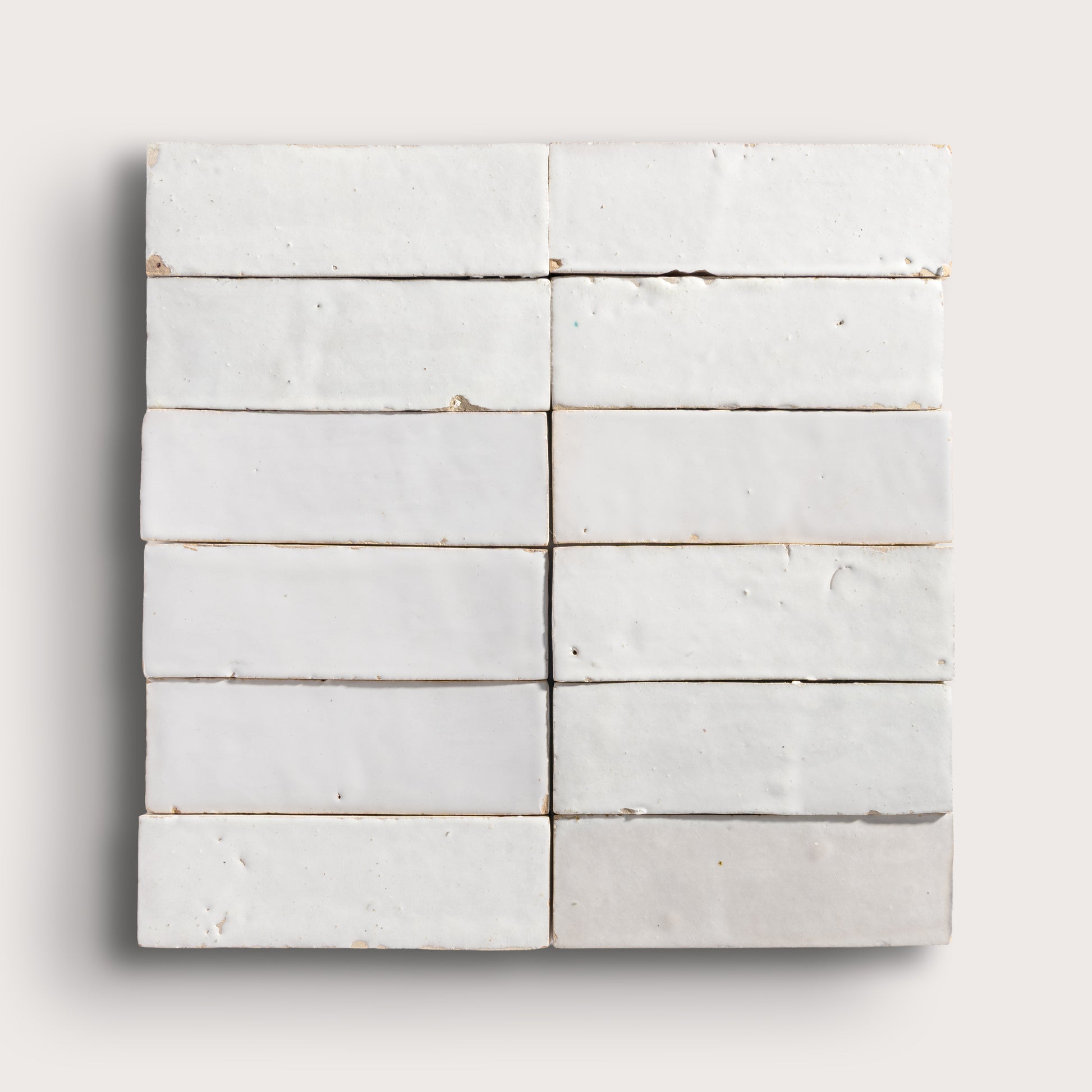 snow white rectangle zellige tile on a light grey background