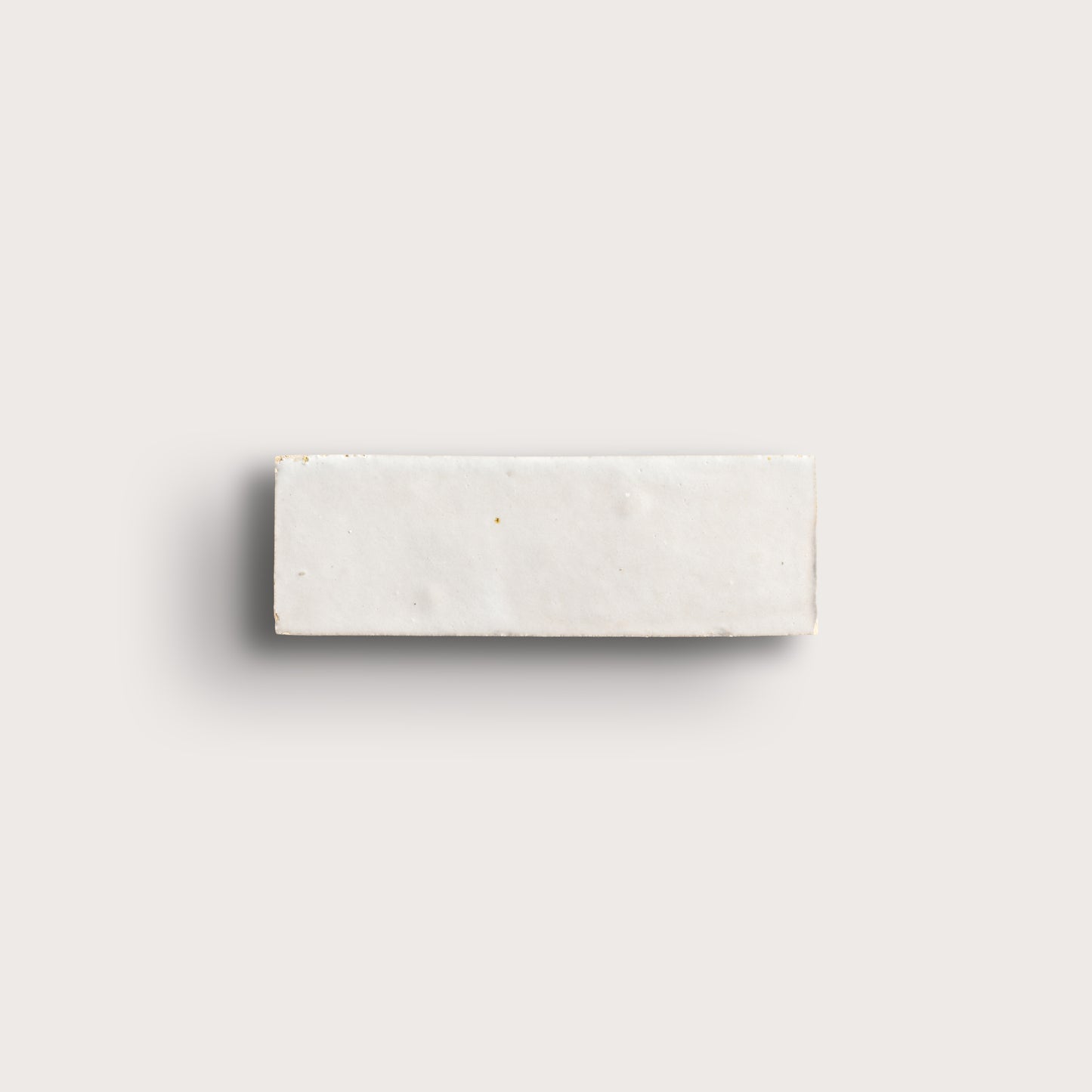 snow white rectangle zellige tile on a light grey background