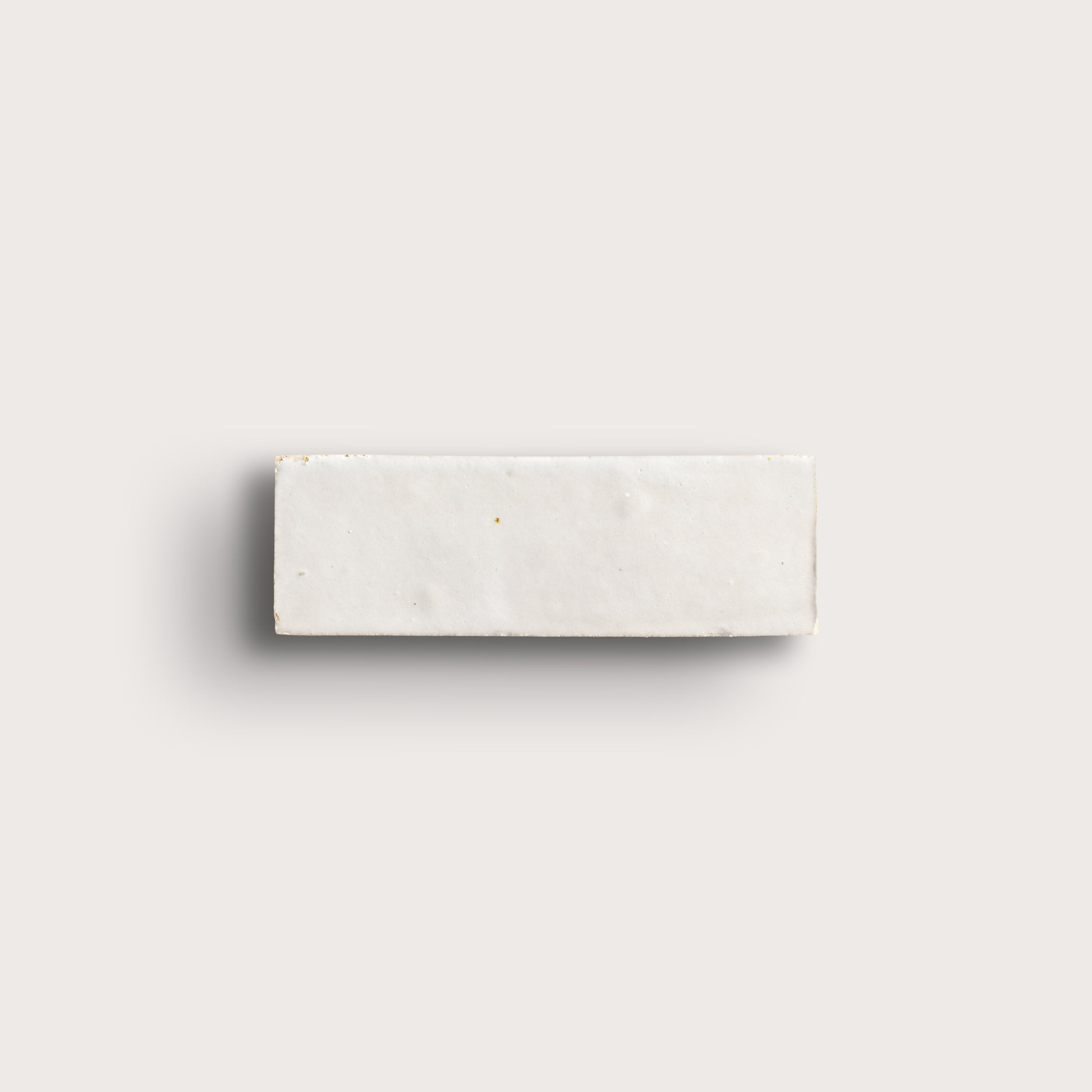 snow white rectangle zellige tile on a light grey background