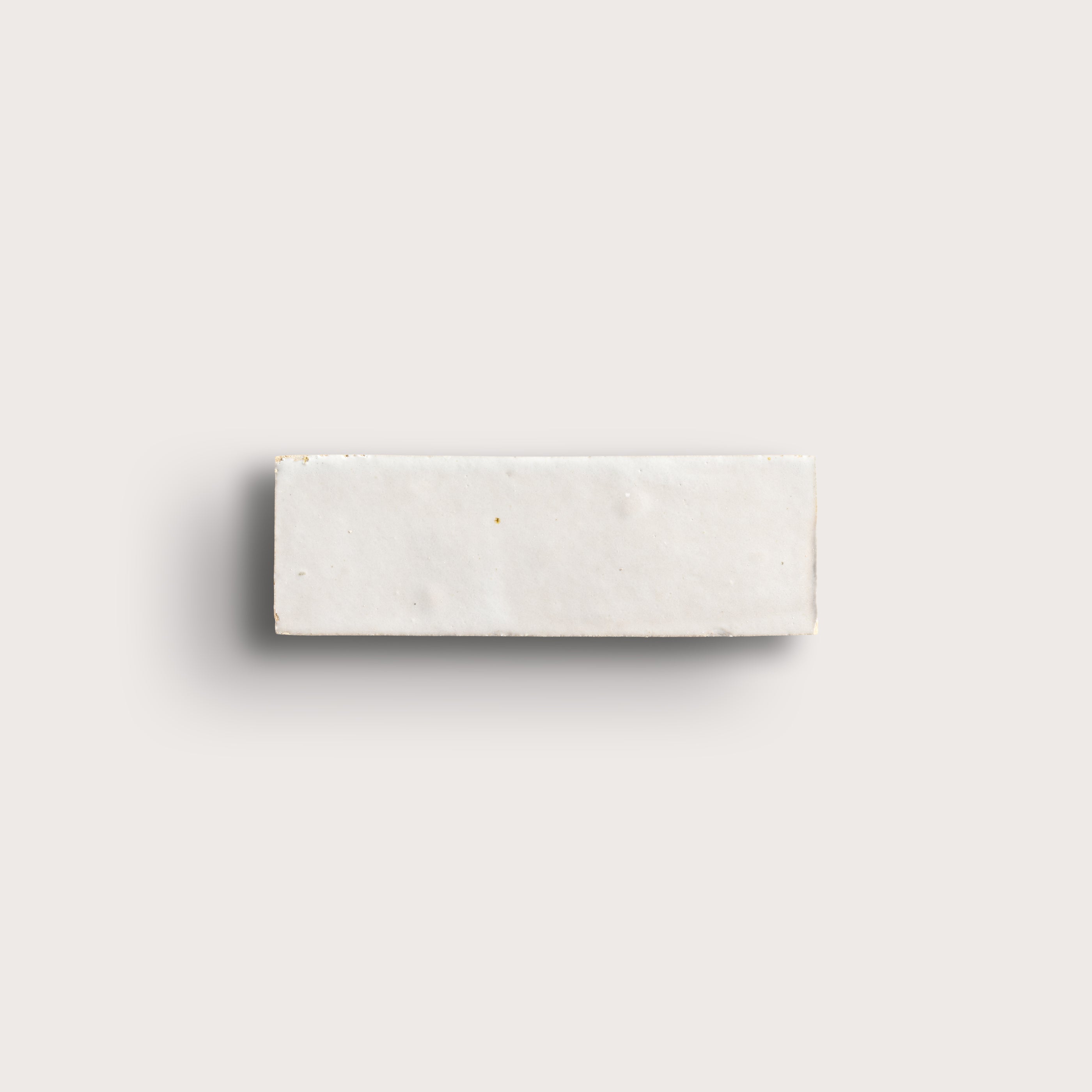 snow white rectangle zellige tile on a light grey background