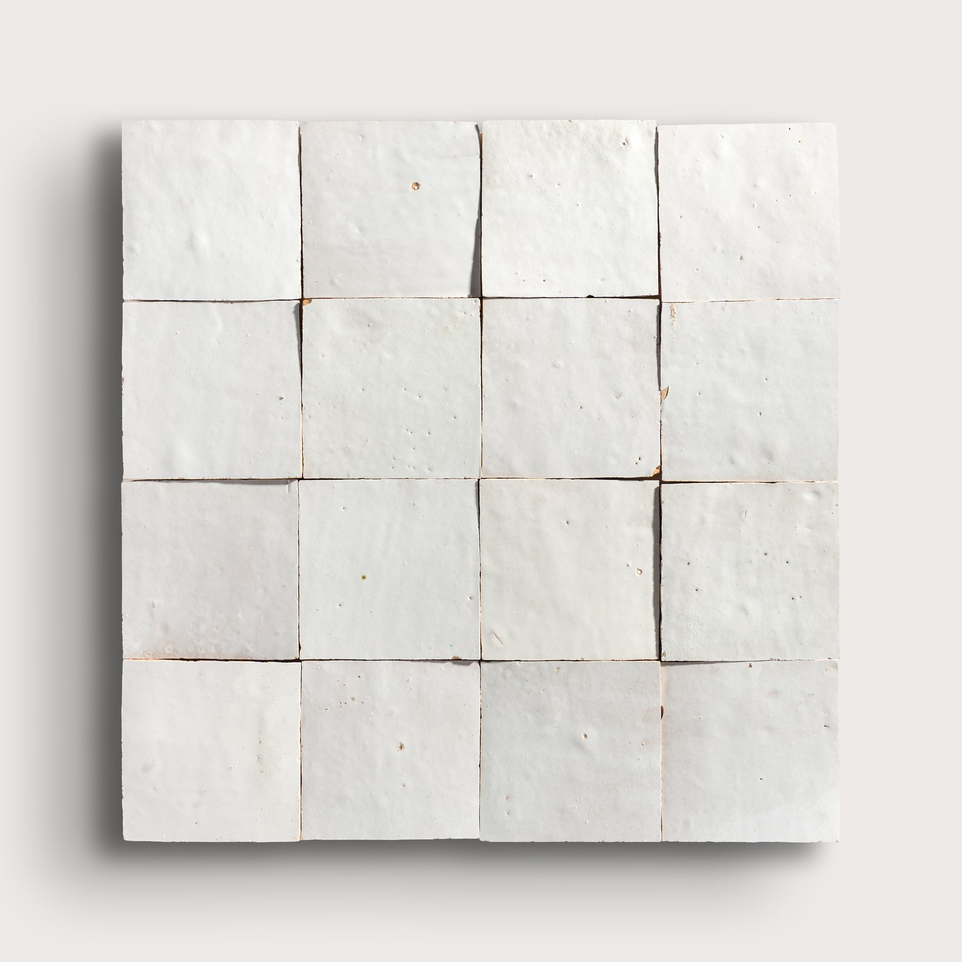 snow white square zellige tile on a light grey background