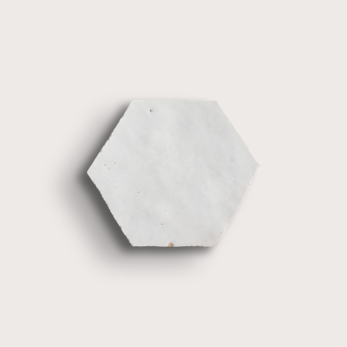 snow white hexagon zellige tile on a light grey background