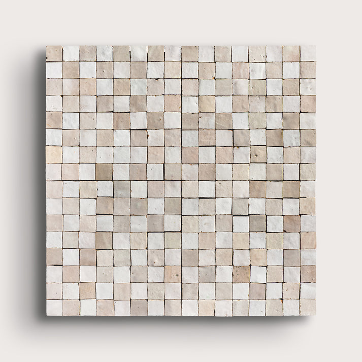white small square checkerboard zellige tile on a light grey background