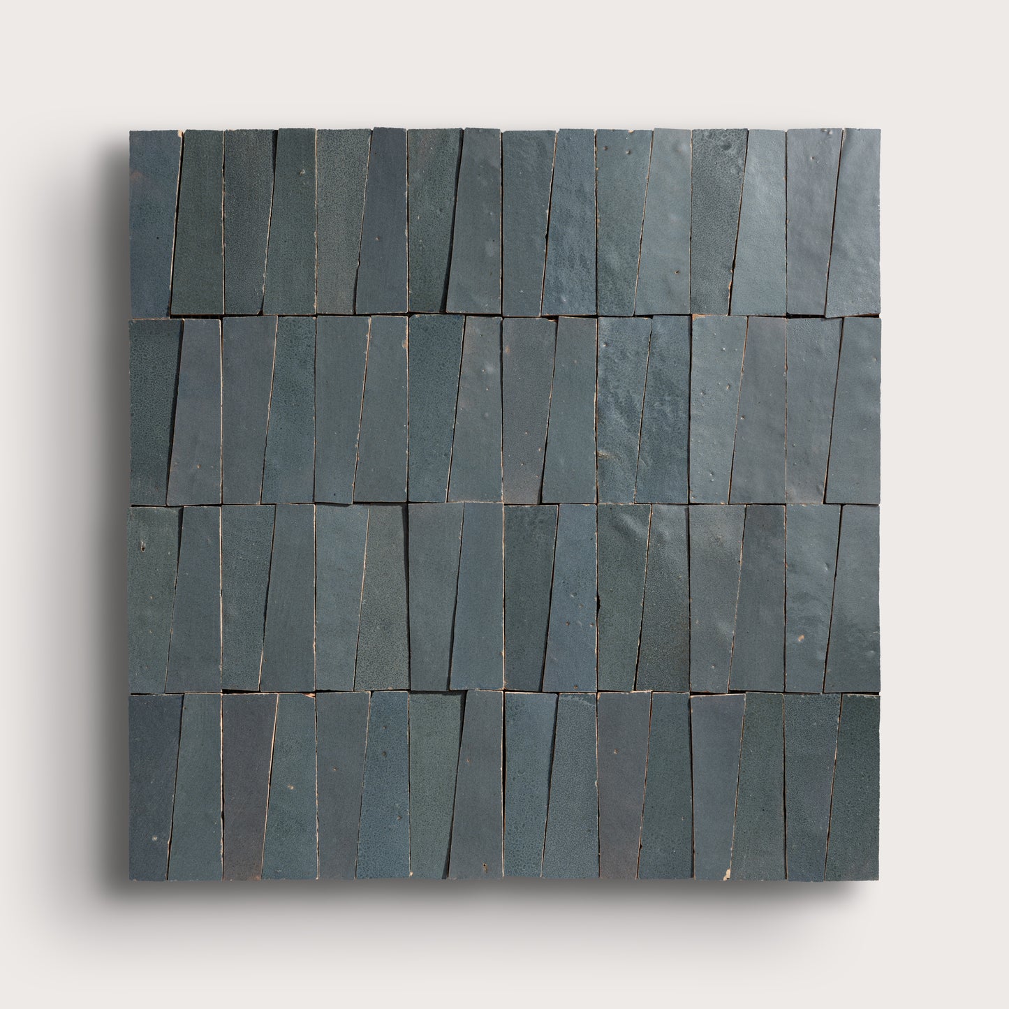 Set of zellige tiles arranged in a pattern on a light gray background