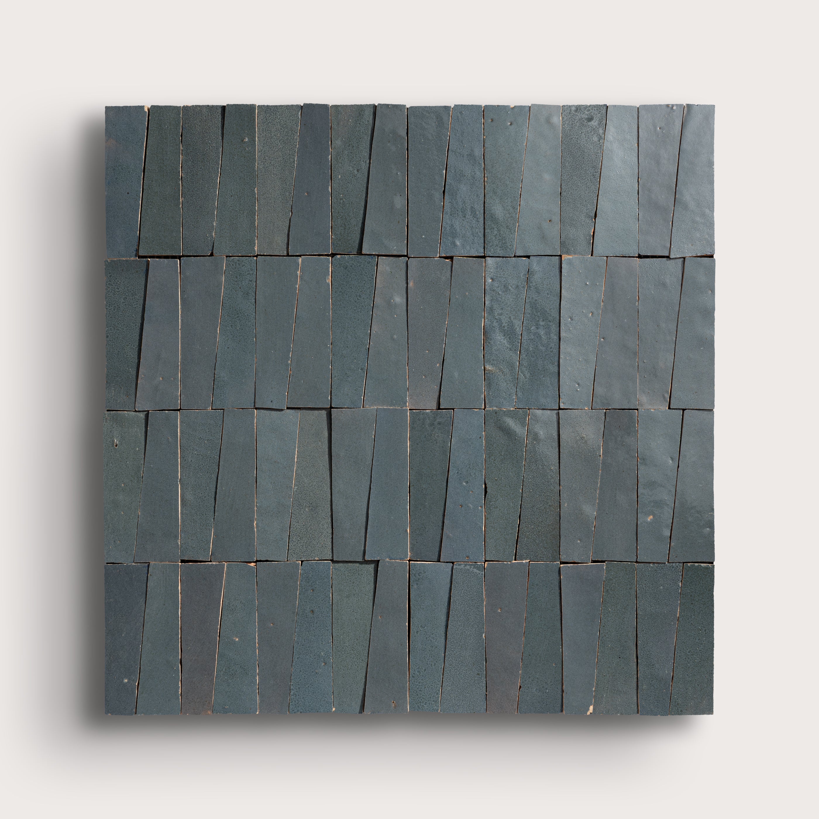 Set of zellige tiles arranged in a pattern on a light gray background