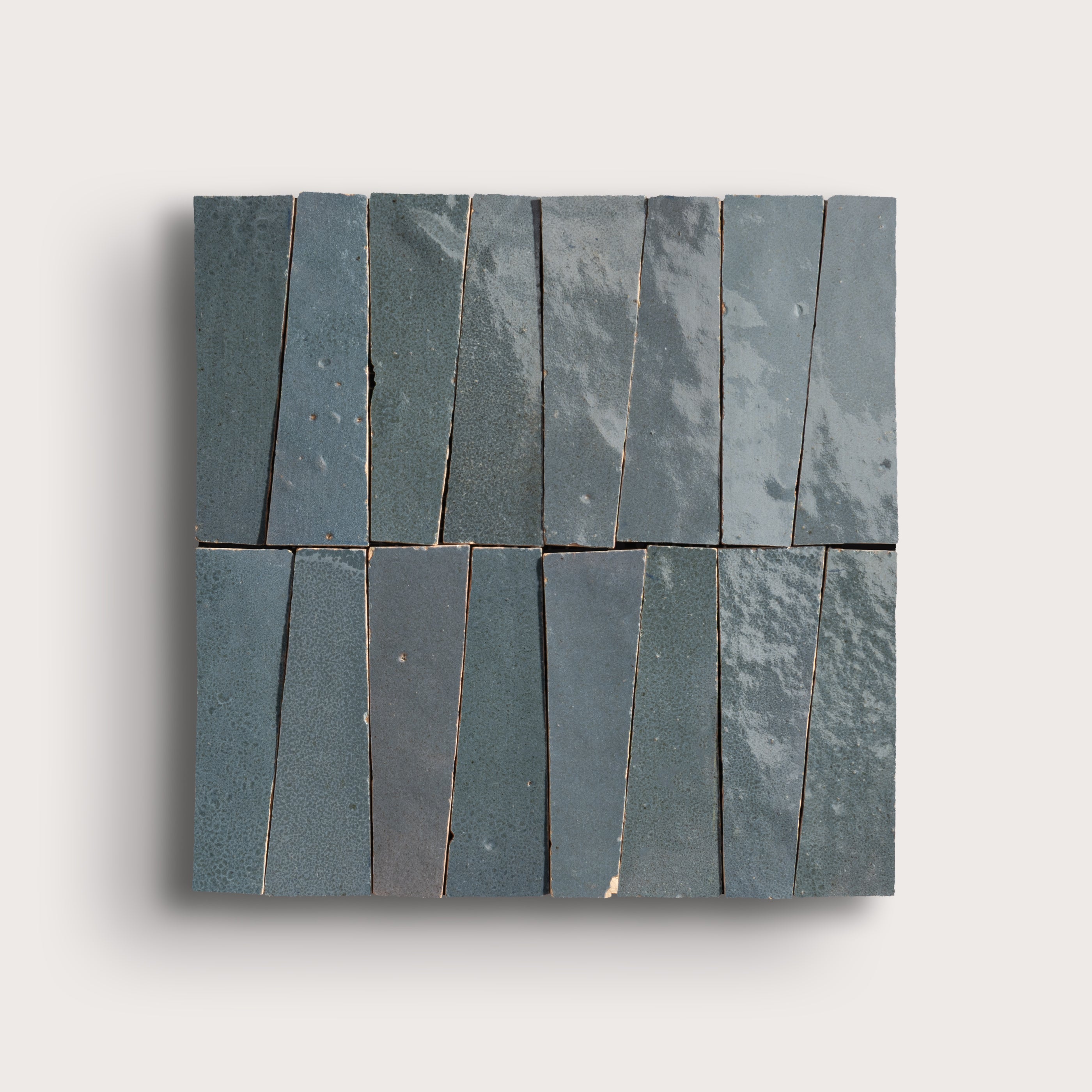 Set of zellige tiles arranged in a pattern on a light gray background